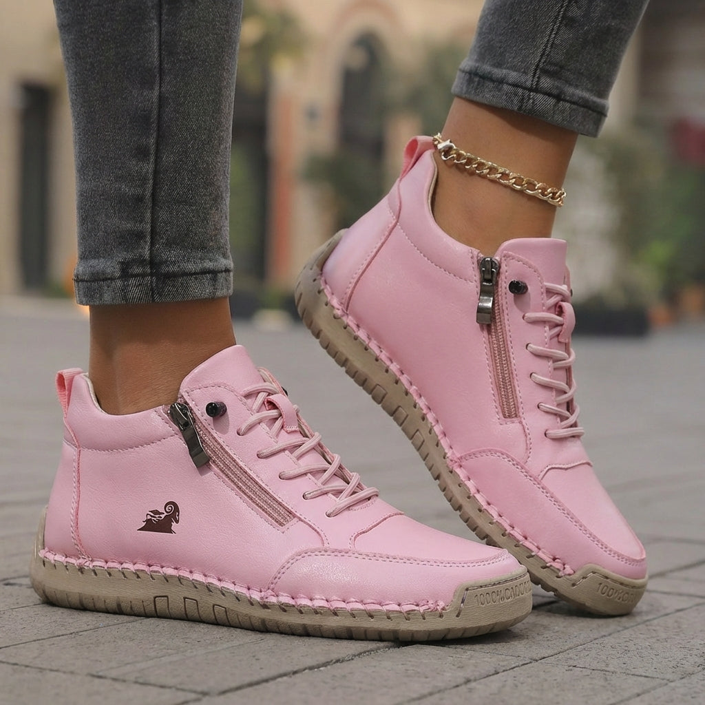 Mila trainers in pink worn with jeans, side zip detail