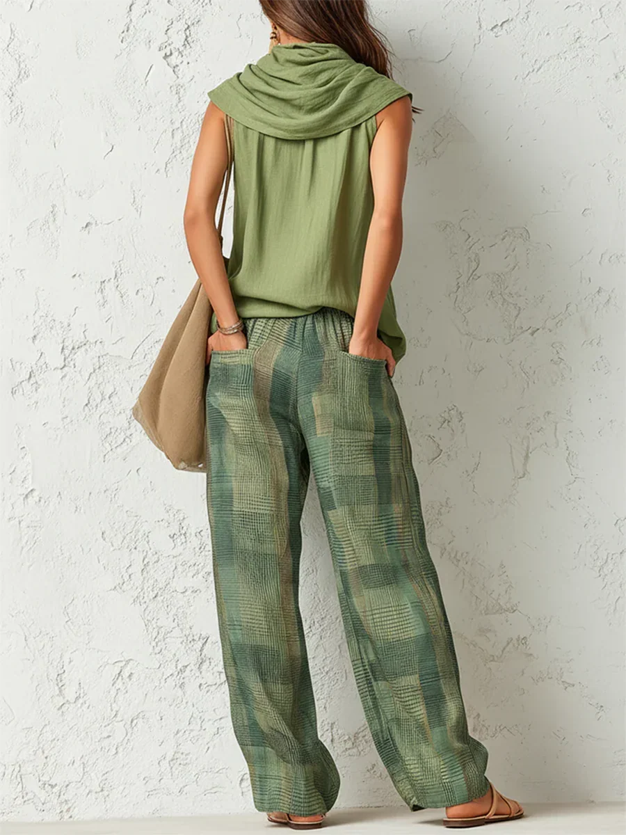 Essenza two-piece set in green, back view showing trouser pockets
