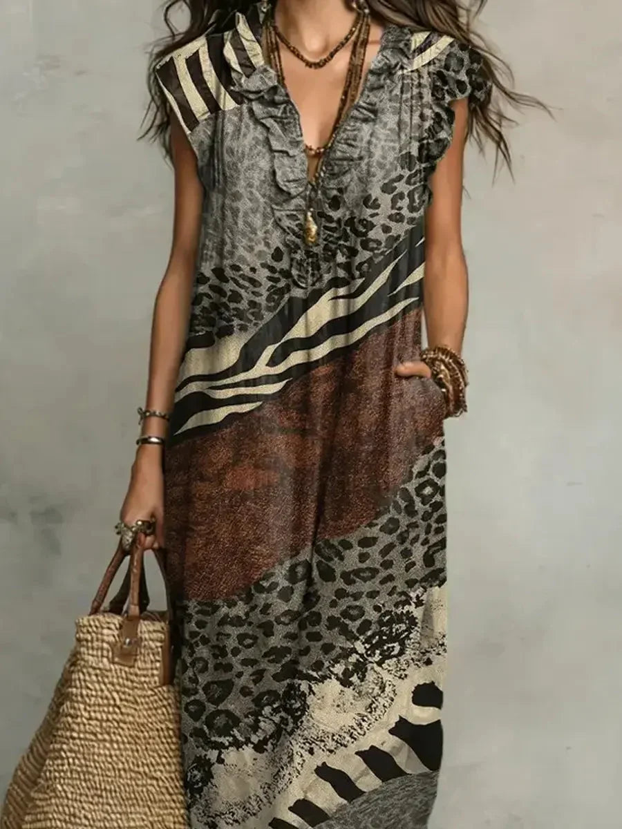 Zola maxi dress in animal mixed print, close front view of V-neckline