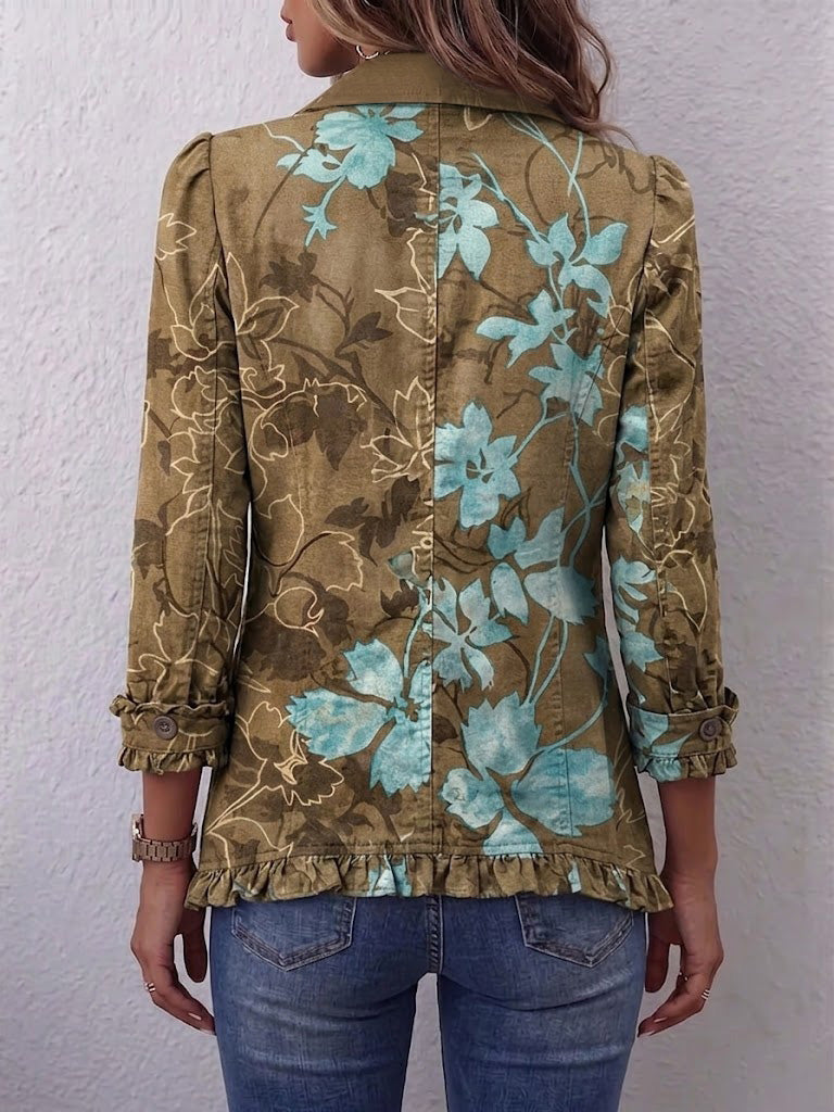 Salud floral ruffle jacket in olive and turquoise, back view with ruffle hem