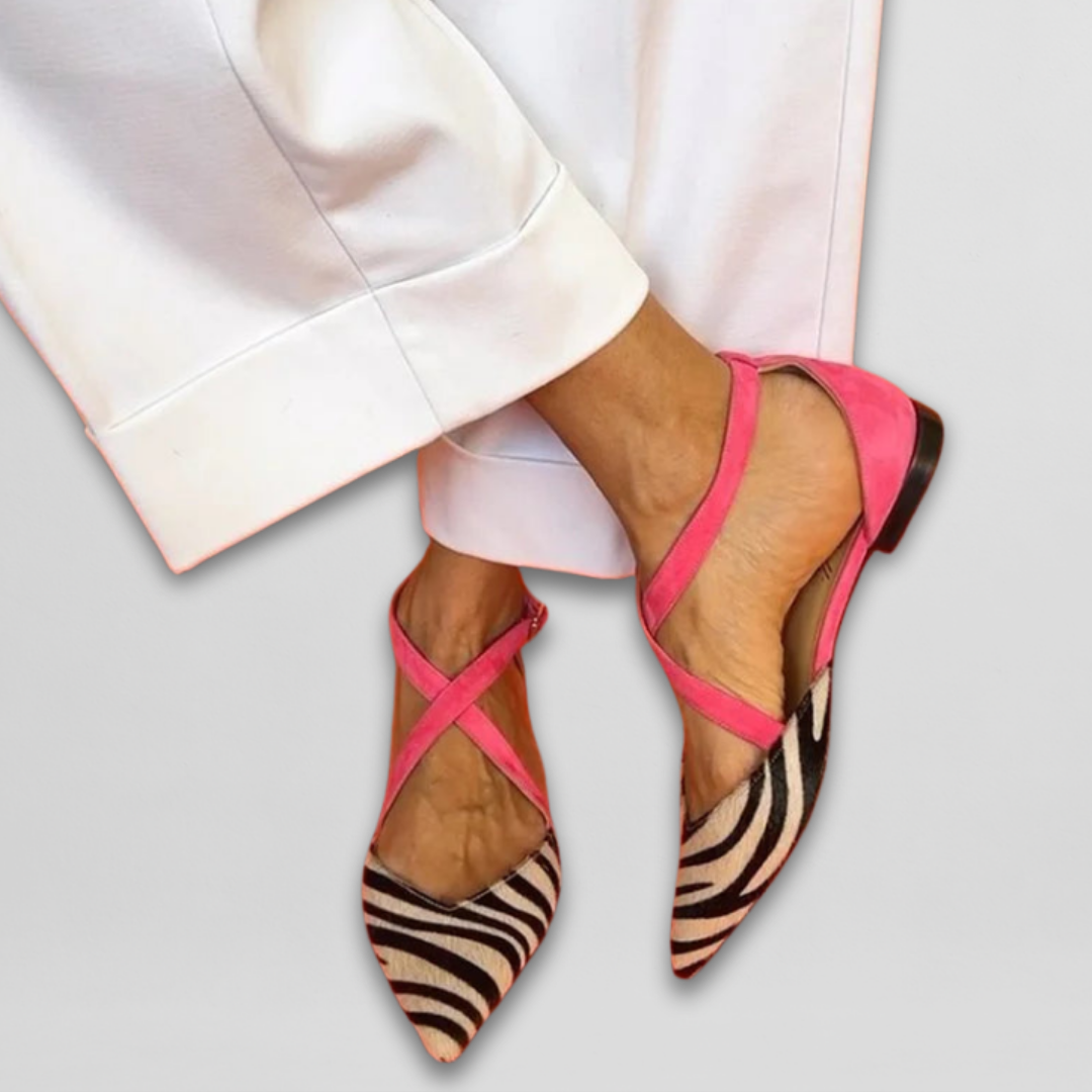 Ornella strappy ballet flats in zebra print with pink straps, worn front view
