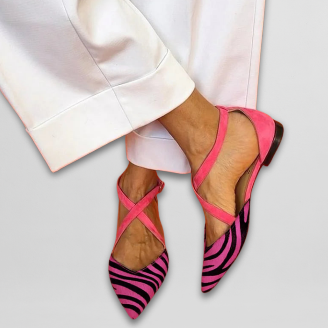 Ornella strappy ballet flats in pink zebra print, worn front view