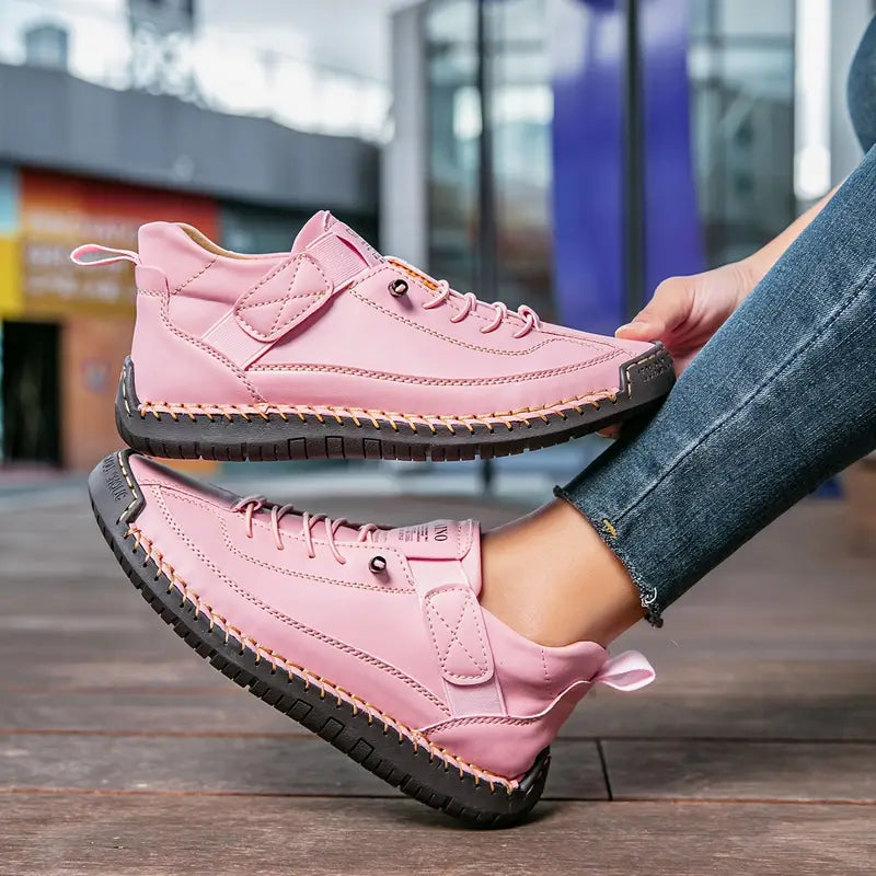 Thessaly supportive sneakers in pink, close-up of stitched sole and side panel