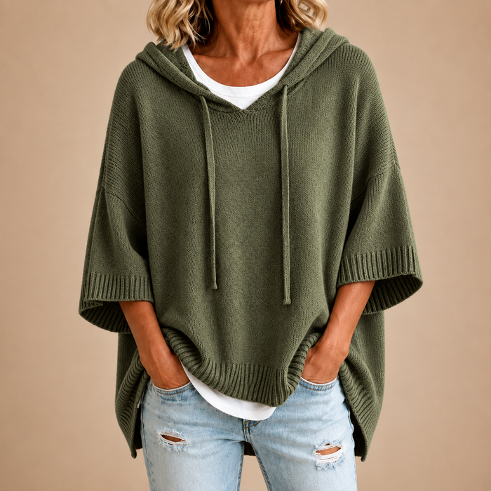 Hooded knit poncho in olive green, front view