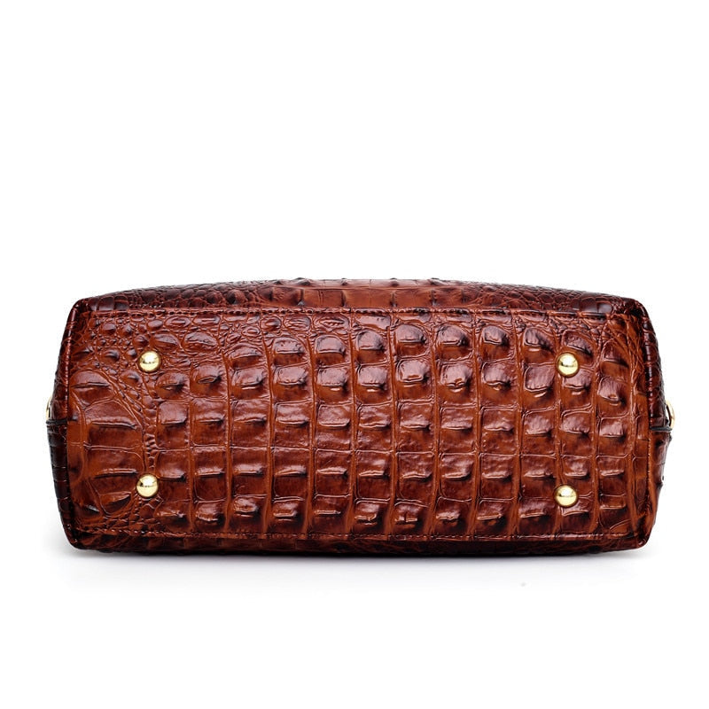 Base of Frances brown shoulder bag with gold metal feet