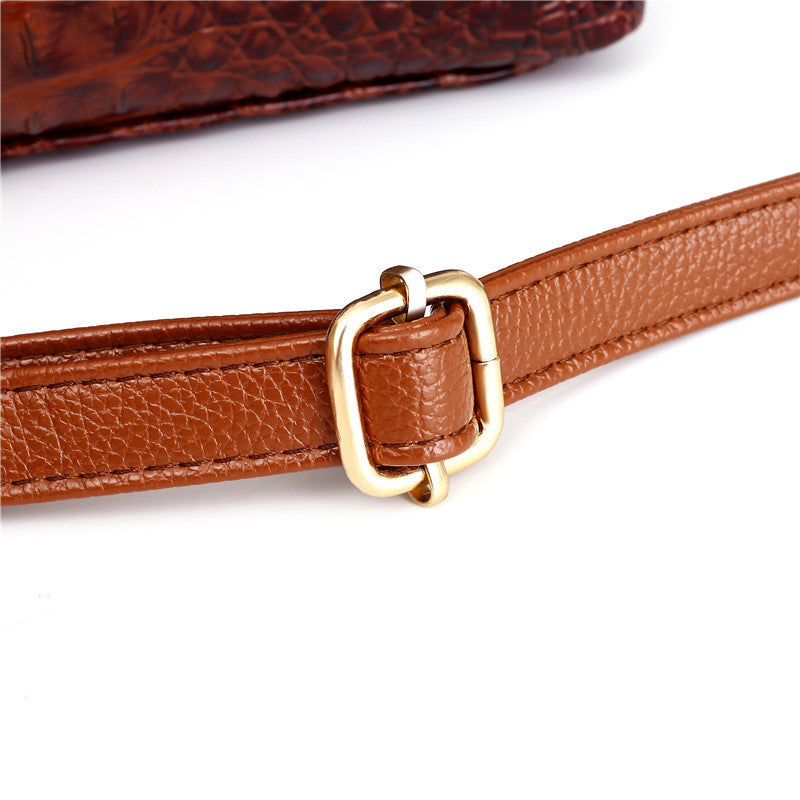 Close-up of Frances shoulder strap with gold buckle adjuster