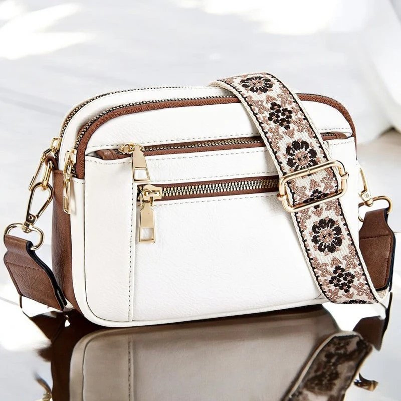 Eira crossbody bag in white with brown trim and woven floral strap