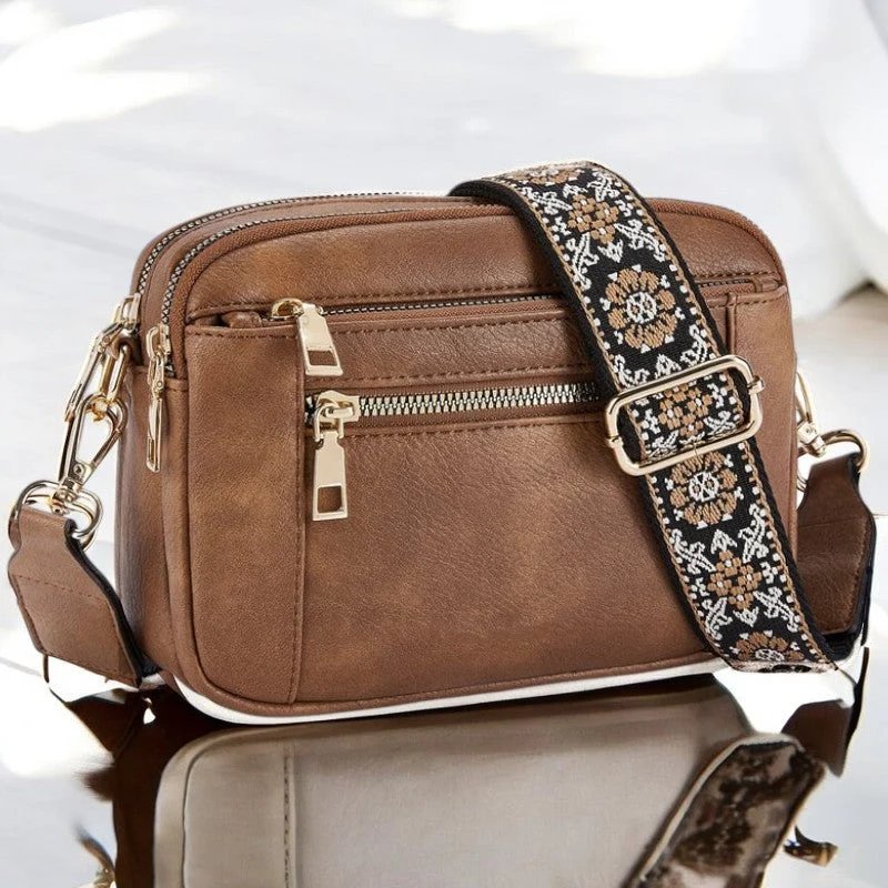 Eira crossbody bag in brown, front view with patterned strap