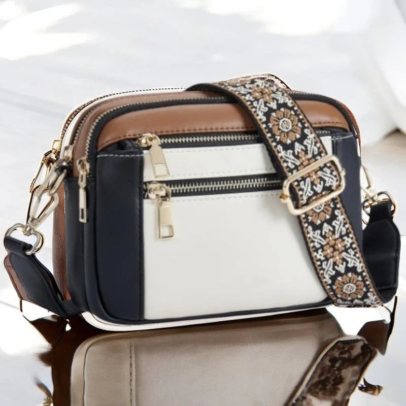 Eira crossbody bag in black, white and brown colourblock, front view