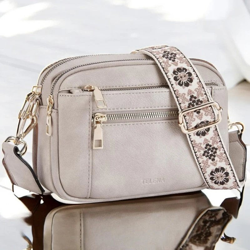 Eira crossbody bag in grey, front view with floral woven strap