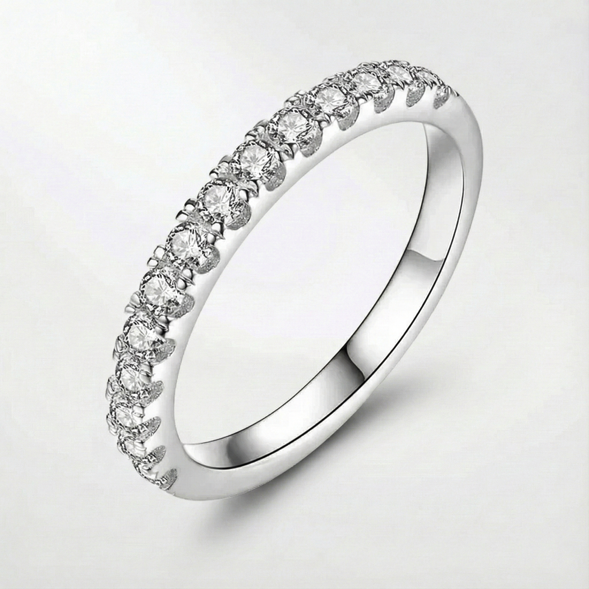 Moissanite ring in white gold tone with a row of round stones