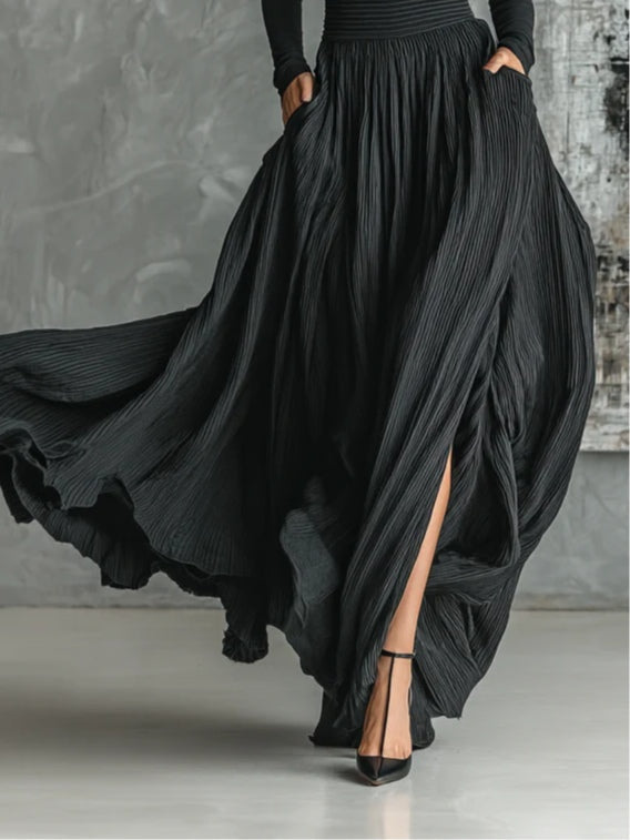 Prudence long skirt in black, close-up showing side slit and pockets