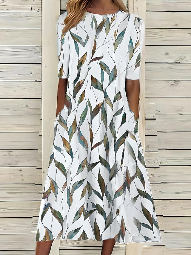 Annie coastal bloom dress in white with green leaf print, front view
