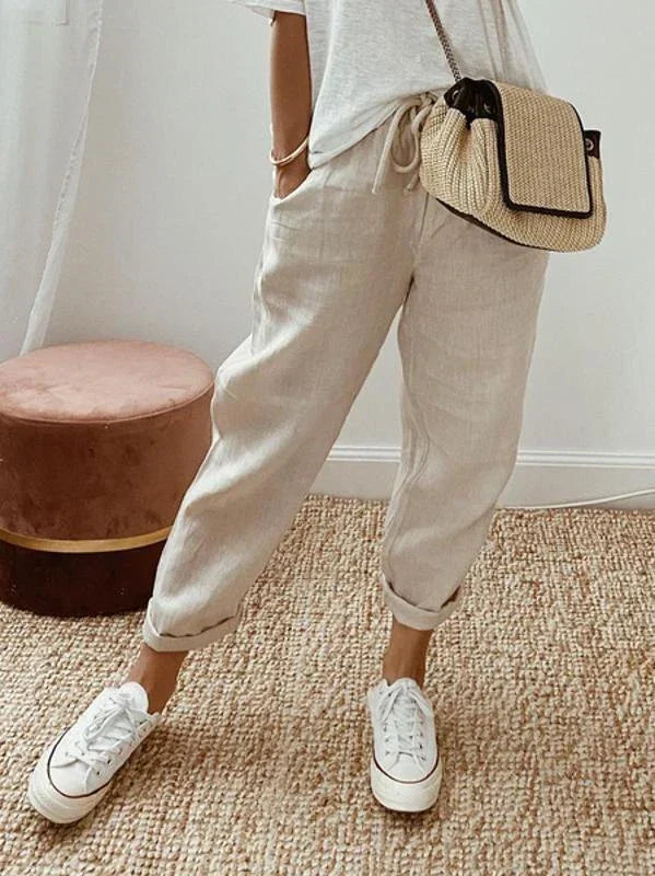 Agatha relaxed summer trousers in beige, front view with turned-up cuffs