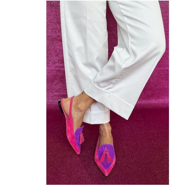 Elena slingback flats in fuchsia and purple with tassels, worn with white trousers
