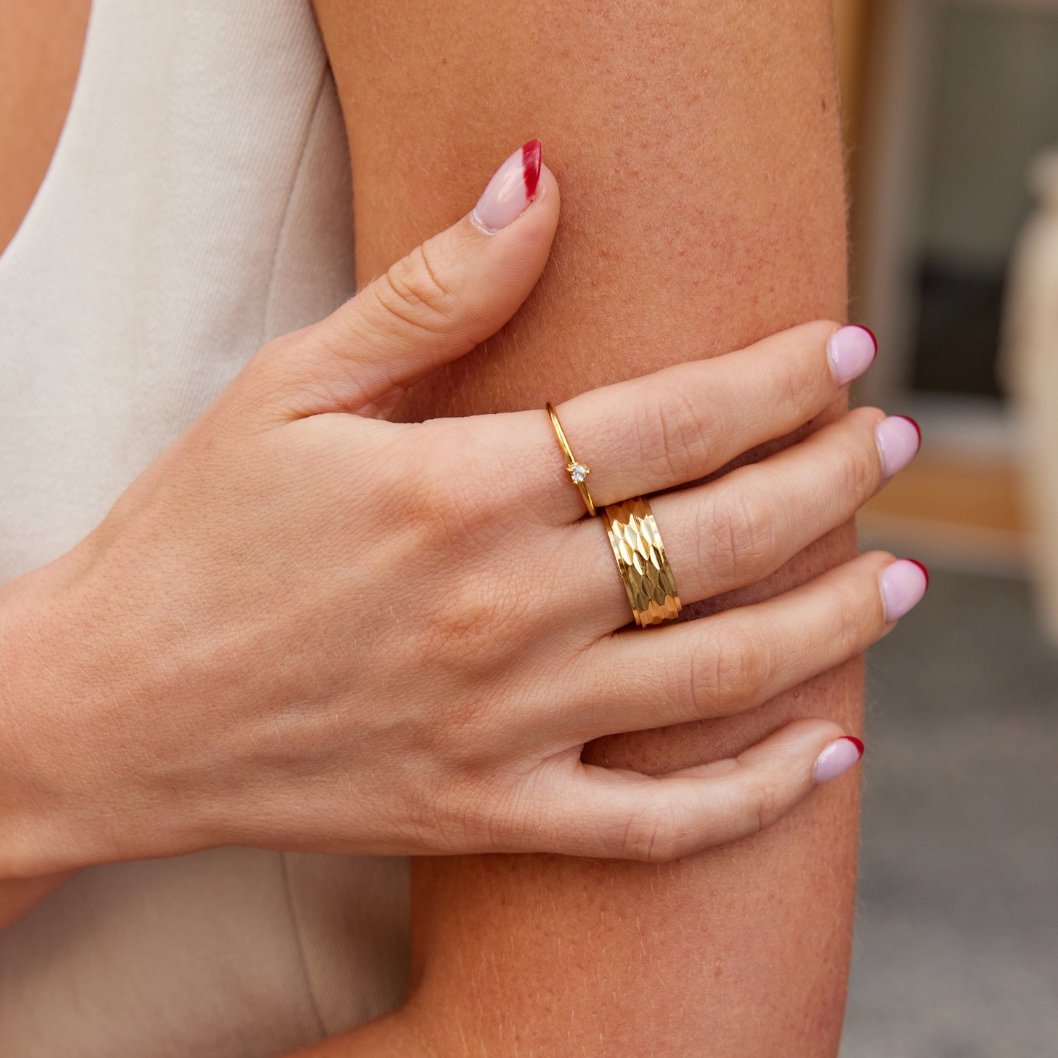 Leonie gold ring in gold worn stacked with a wide gold band