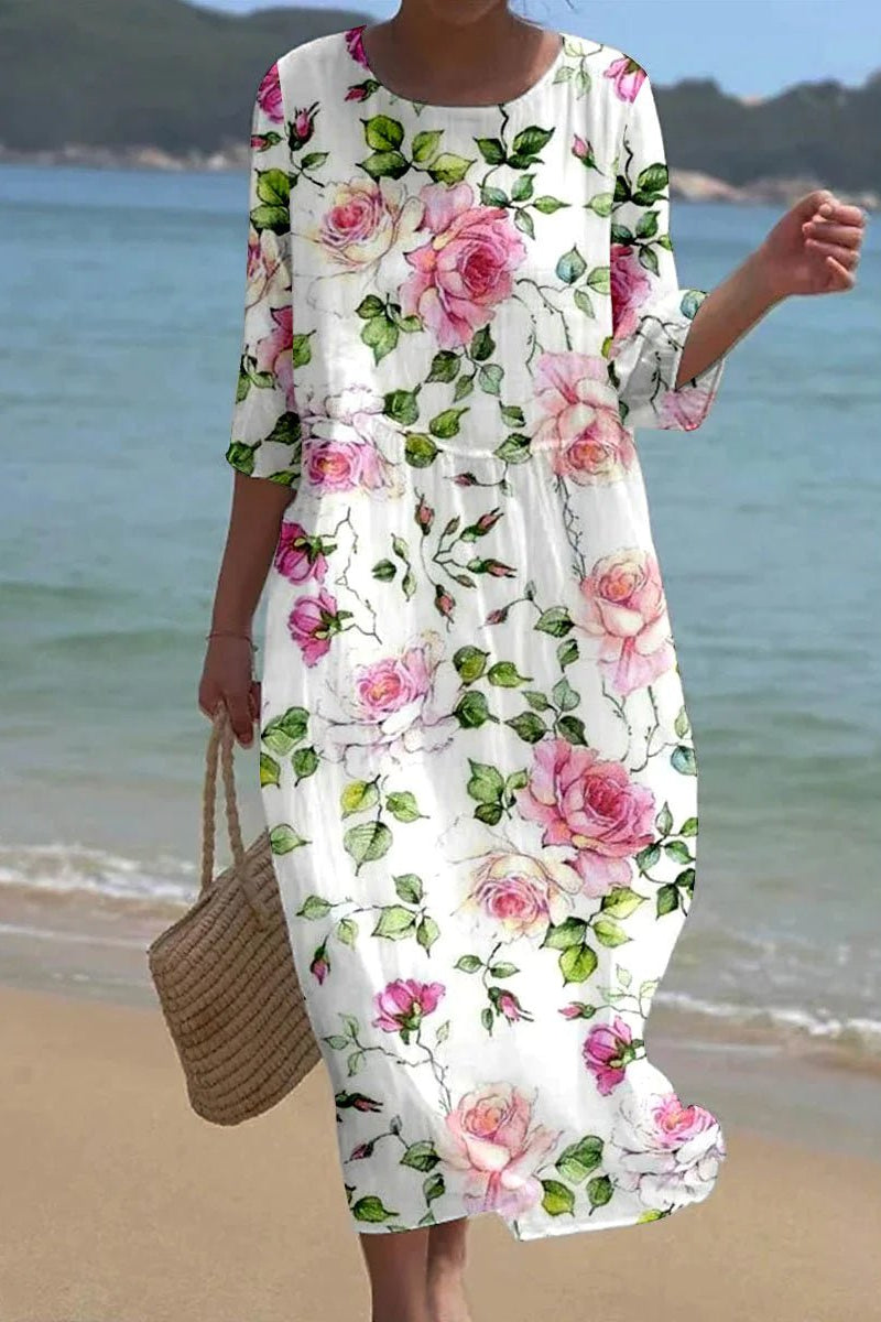 Kira floral midi dress worn on the beach, relaxed flowing view