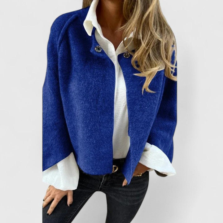 Mavis draped jacket in blue, front view over white shirt