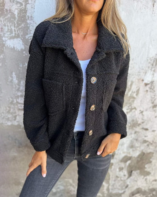 Laverinne cosy teddy jacket in black, worn open over white top