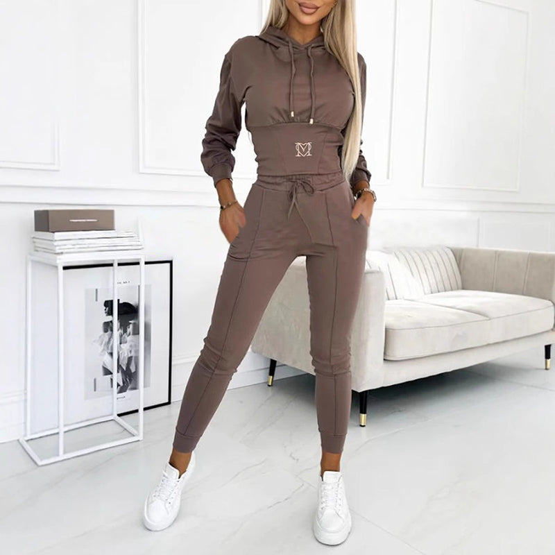 Quinn Icicle tracksuit in brown, full-length front view