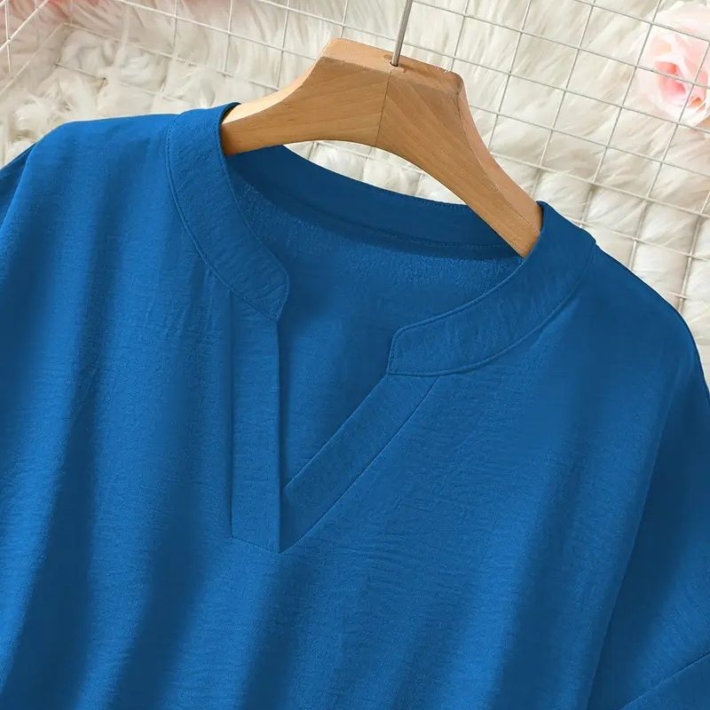 Livia blouse in deep blue, close-up of split V-neckline
