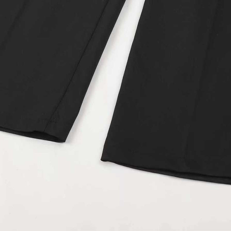 Margaret trousers in black, close-up of straight-leg hems