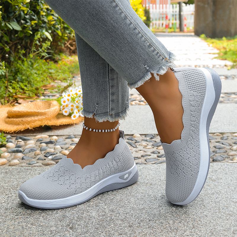 Ruth slip-on walking shoes in grey, worn three-quarter view
