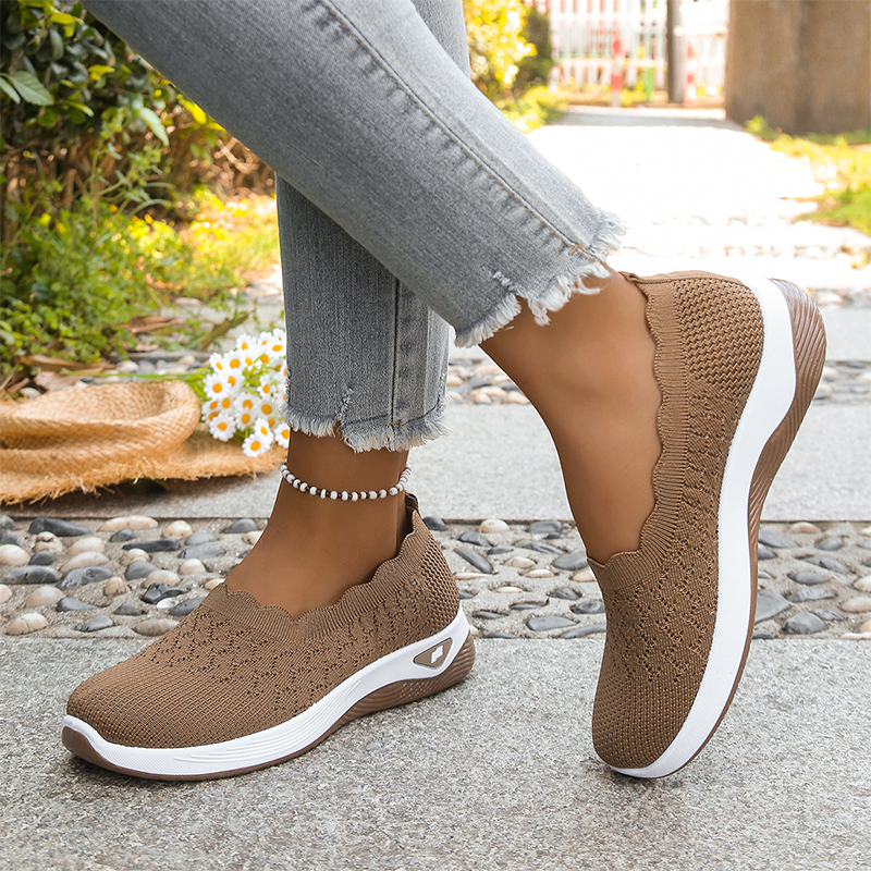 Ruth slip-on walking shoes in brown, worn three-quarter view