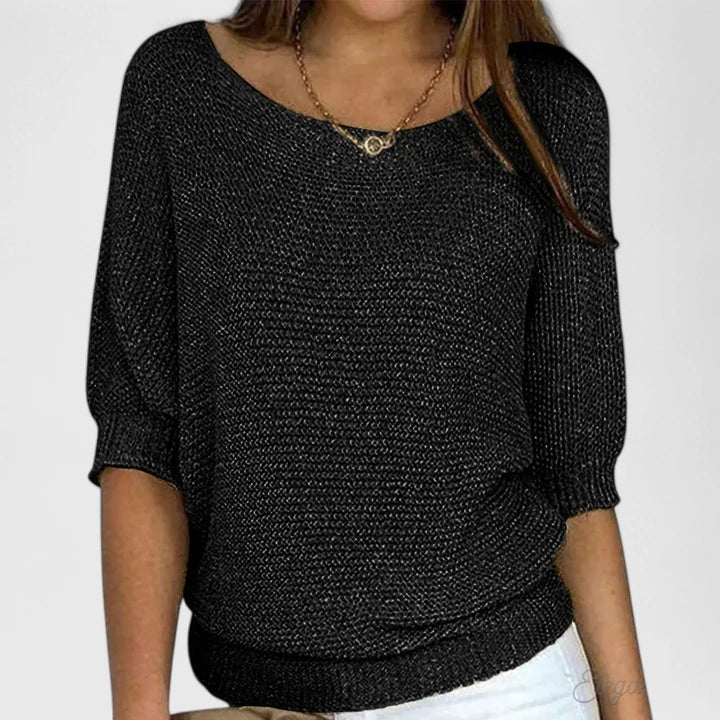 Kalyndrae knitted sweater in black, front view with ribbed hem