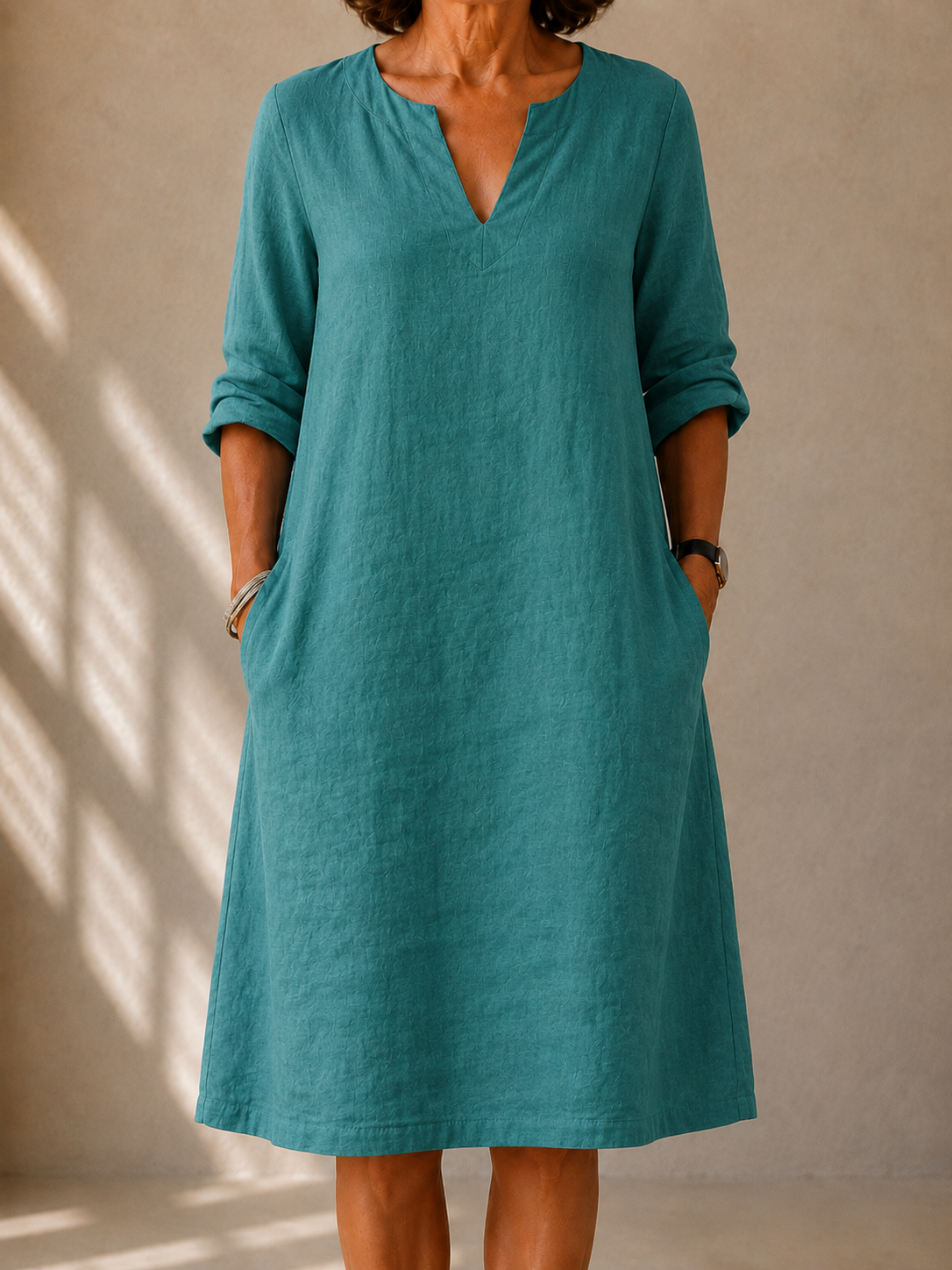 Sophie flowy elegant dress in peacock blue, front view