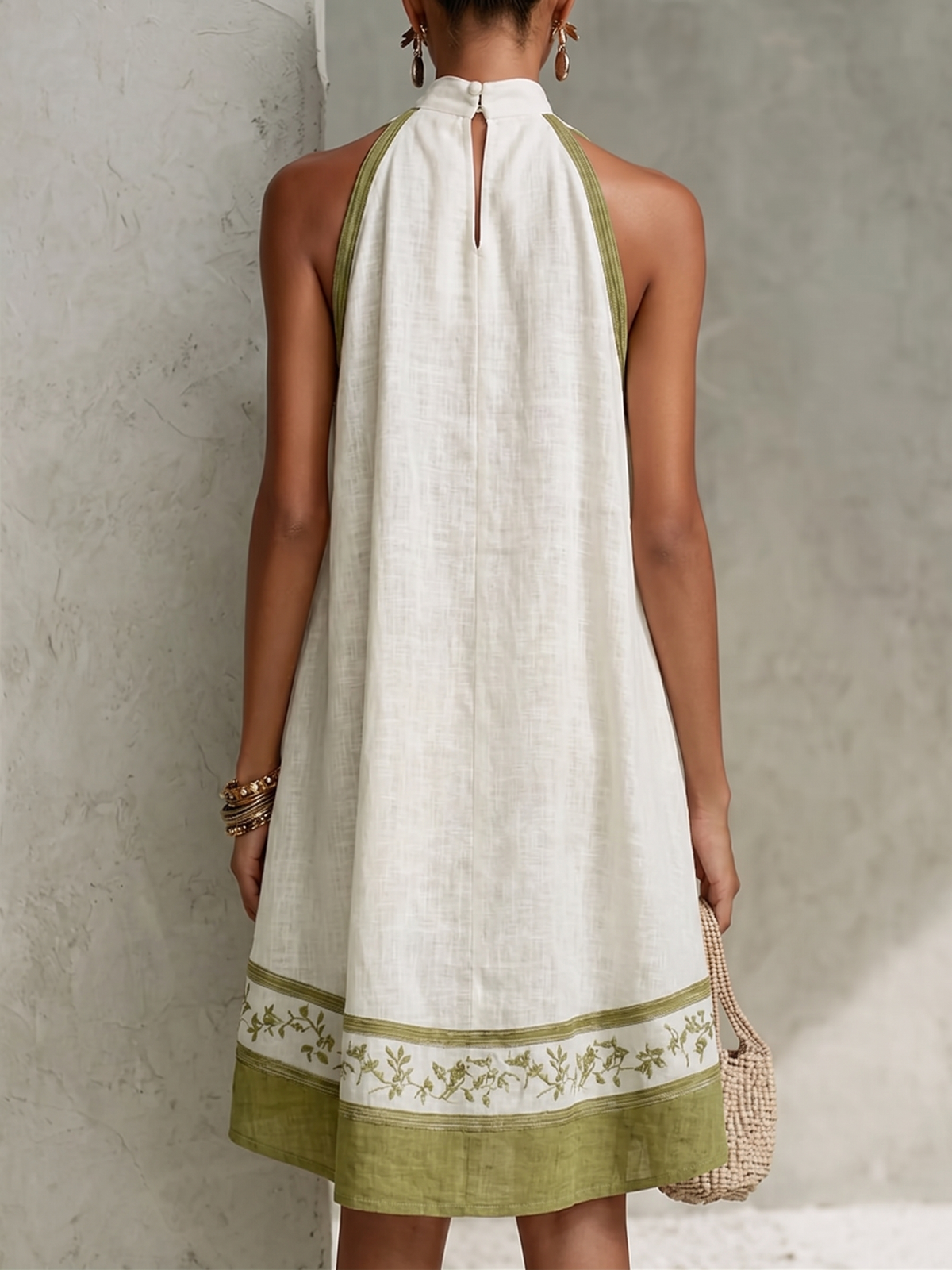 Agathe sleeveless mini dress in white, back view with keyhole button neck