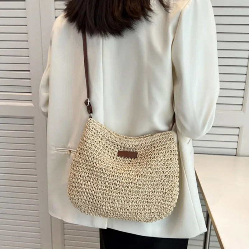 Woven shoulder bag in beige, back view worn crossbody