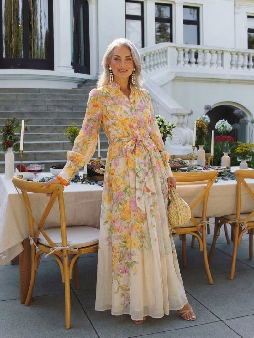 Cressida floral maxi dress in yellow, styled at an outdoor table