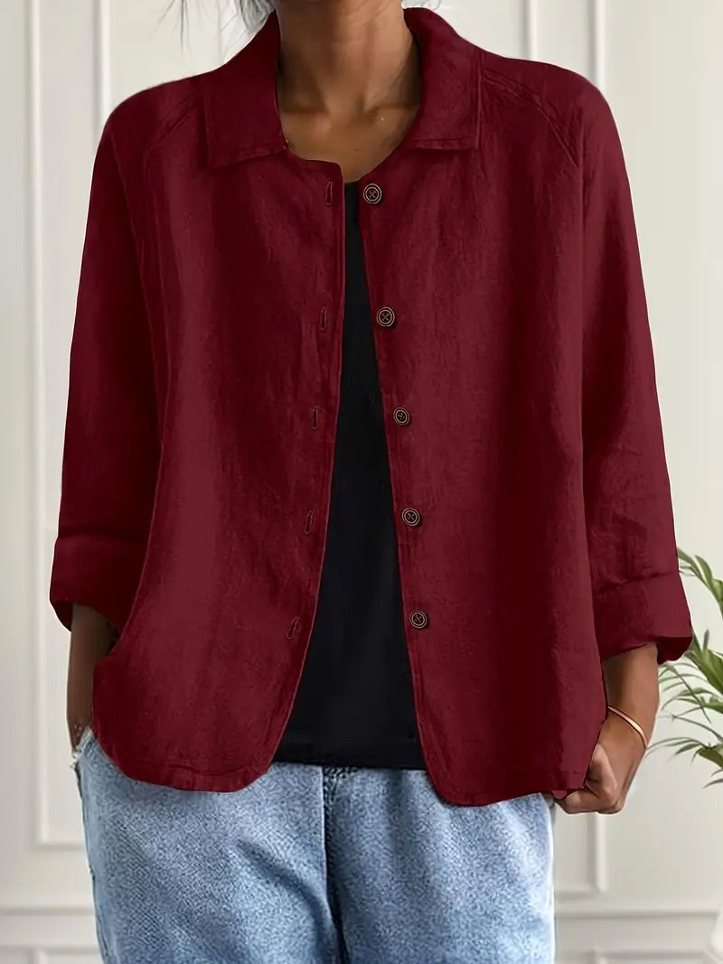 Bathilda open shirt blouse in wine red, worn open over black with denim