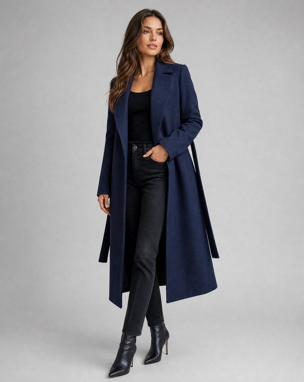 Josie long belted lapel coat in navy, full-length front view worn open with jeans
