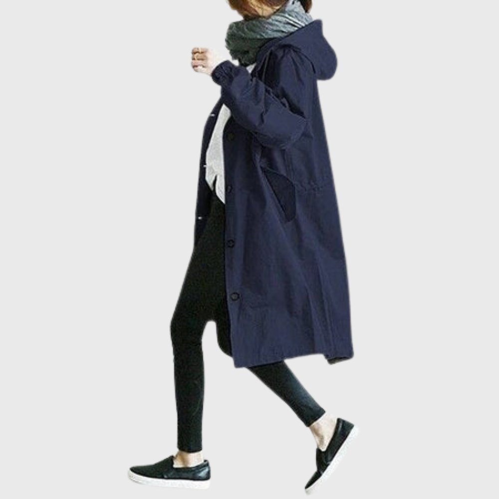Ruth hooded longline trench coat in blue, side view walking
