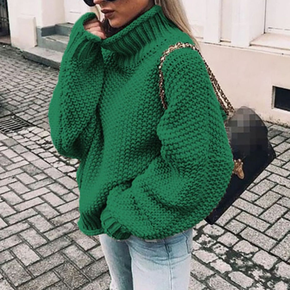Oversized chunky knit turtleneck sweater in green, front view
