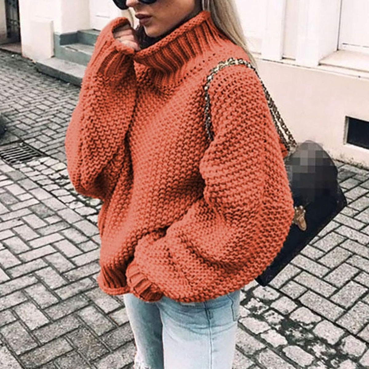 Oversized chunky knit turtleneck sweater in orange, front view