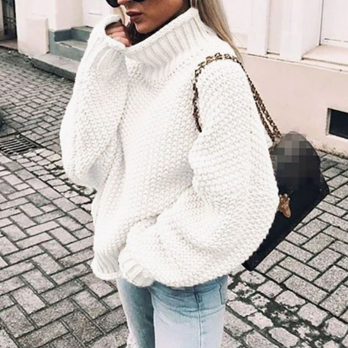 Oversized chunky knit turtleneck sweater in white, close street view