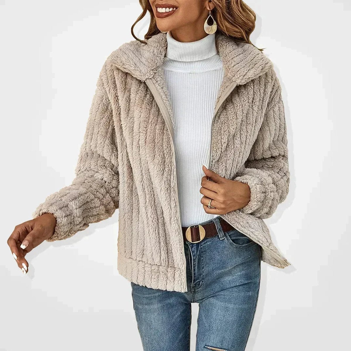 Rita plush zip-up jacket in light beige, worn open with jeans