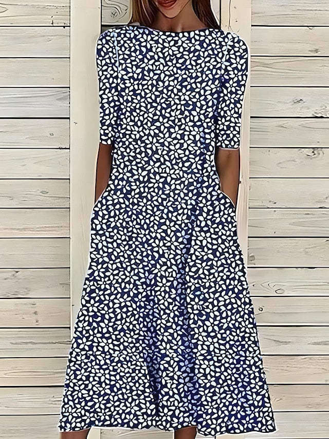 Annie coastal bloom dress in dark blue with white floral print, front view